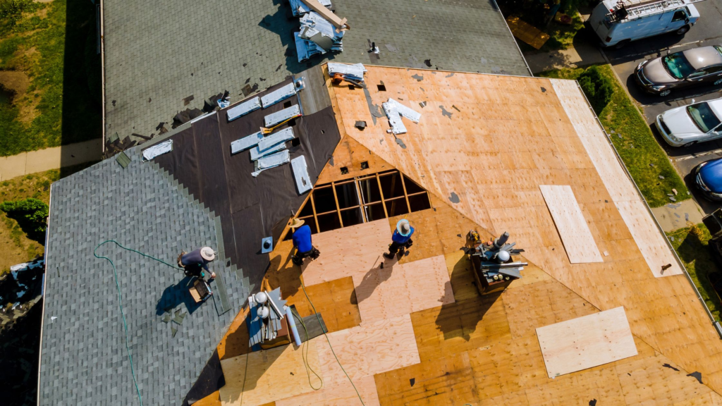 Commercial roofing crew working on a flat roof in Detroit, MI