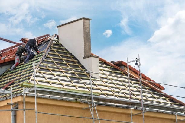 Roofers installing a new roof over battens and underlayment