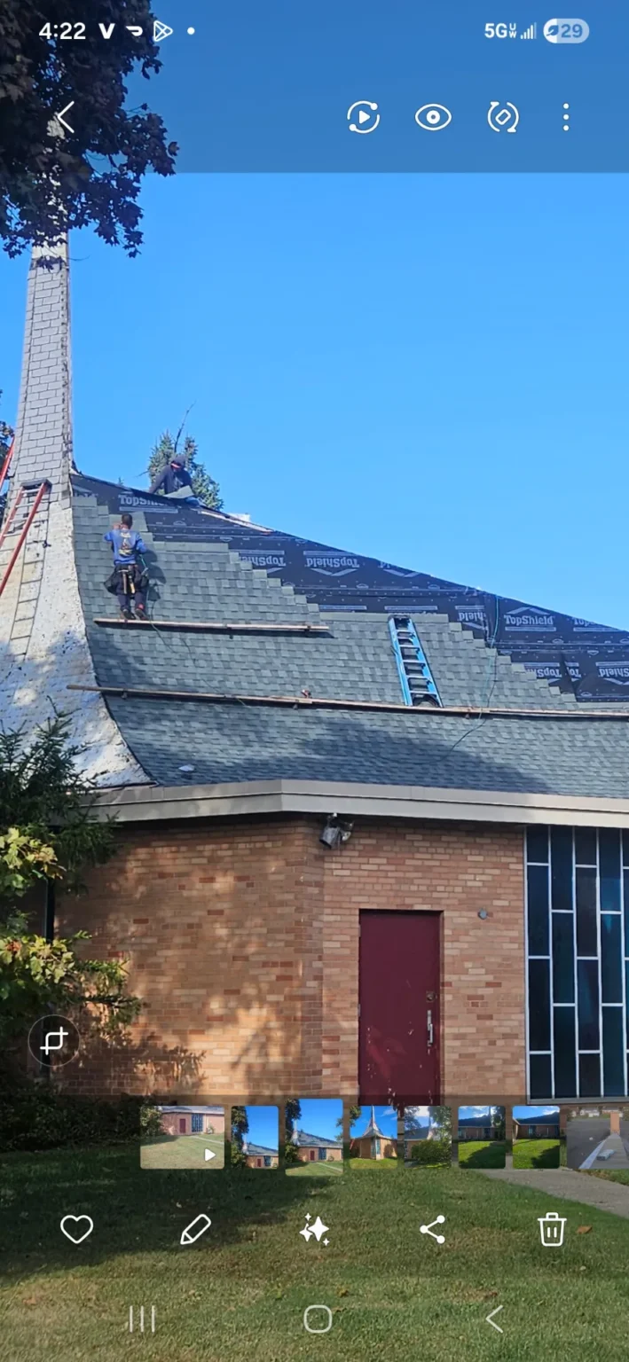 Roofing crew on a church roof – T&M Roofing project