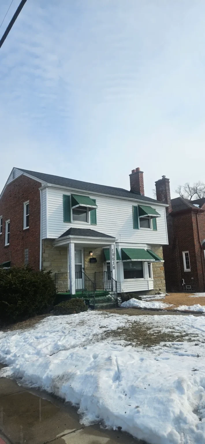Colonial home with a finished new shingle roof by T&M Roofing