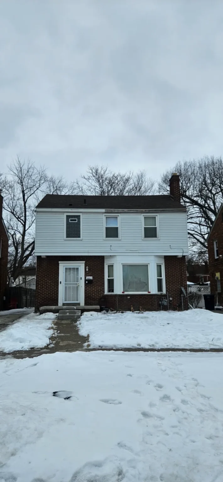 Colonial home with a new roof completed by T&M Roofing in winter