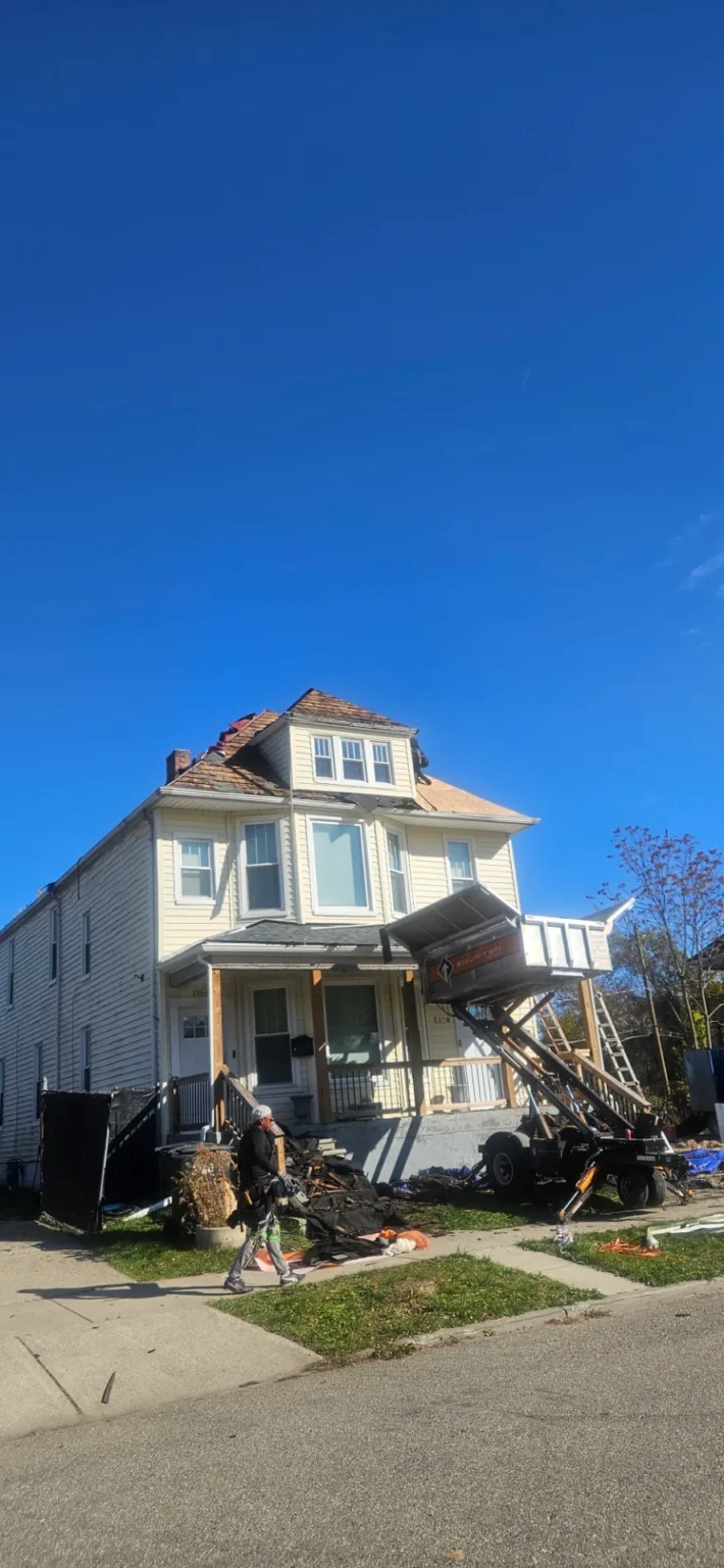 Tall house with a completed roof replacement by T&M Roofing